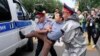 Kazakhstan President - Kazakh police detain a demonstrator in Almaty, Kazakhstan, Wednesday, June 12, 2019, during protests against presidential elections. Protests have continued in the capital, Nur-Sultan, and in Almaty, Kazakhstan's principal city. Pol