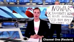 RUSSIA – Marina Ovsyannikova with a poster "NO WAR. Stop the war. Don't believe propaganda. They are lying to you here."during a live news bulletin on Russia's state TV "Channel One", March 14, 2022